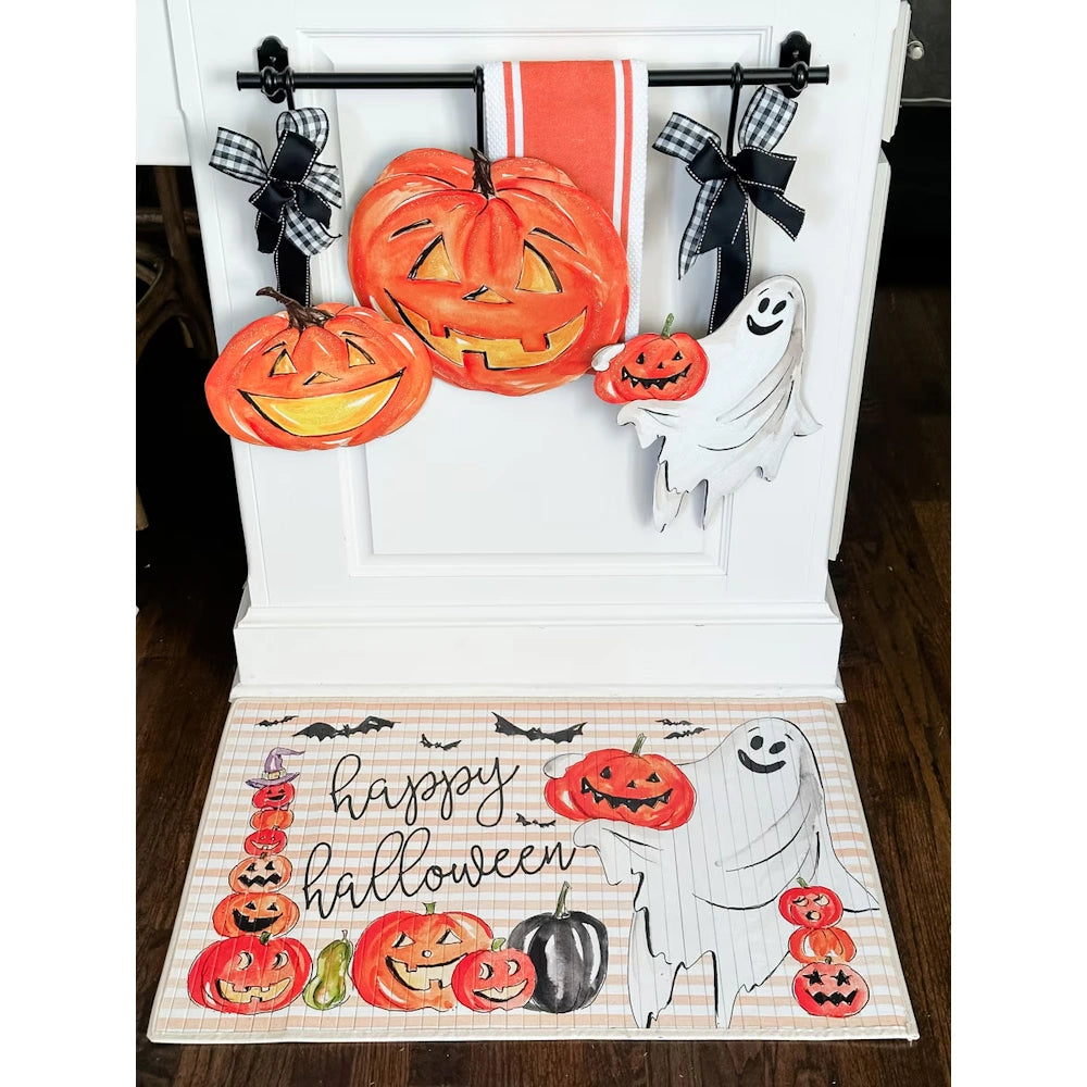 Halloween door hangers featuring jack o lanterns and a friendly ghost matching a Happy Halloween floor mat.
