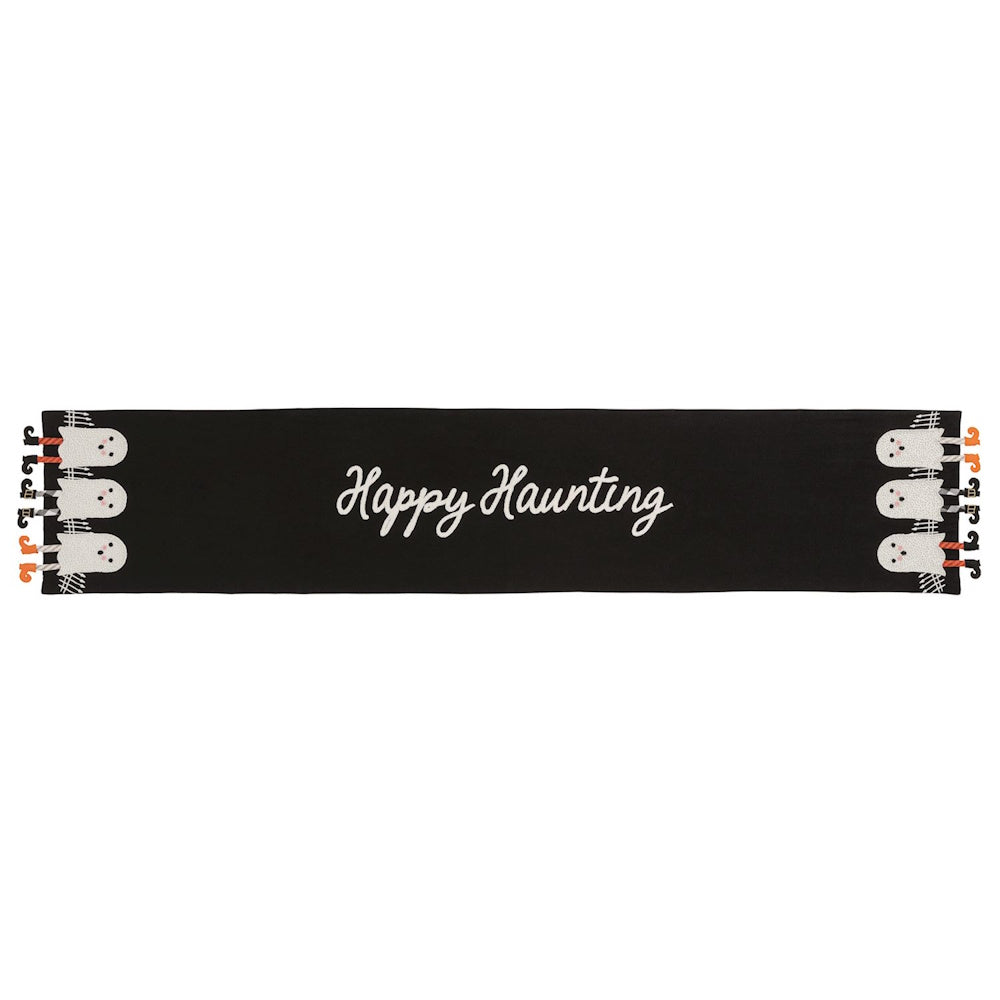 Black table runner with "Happy Haunting" text and ghosts with dangling legs at each end.