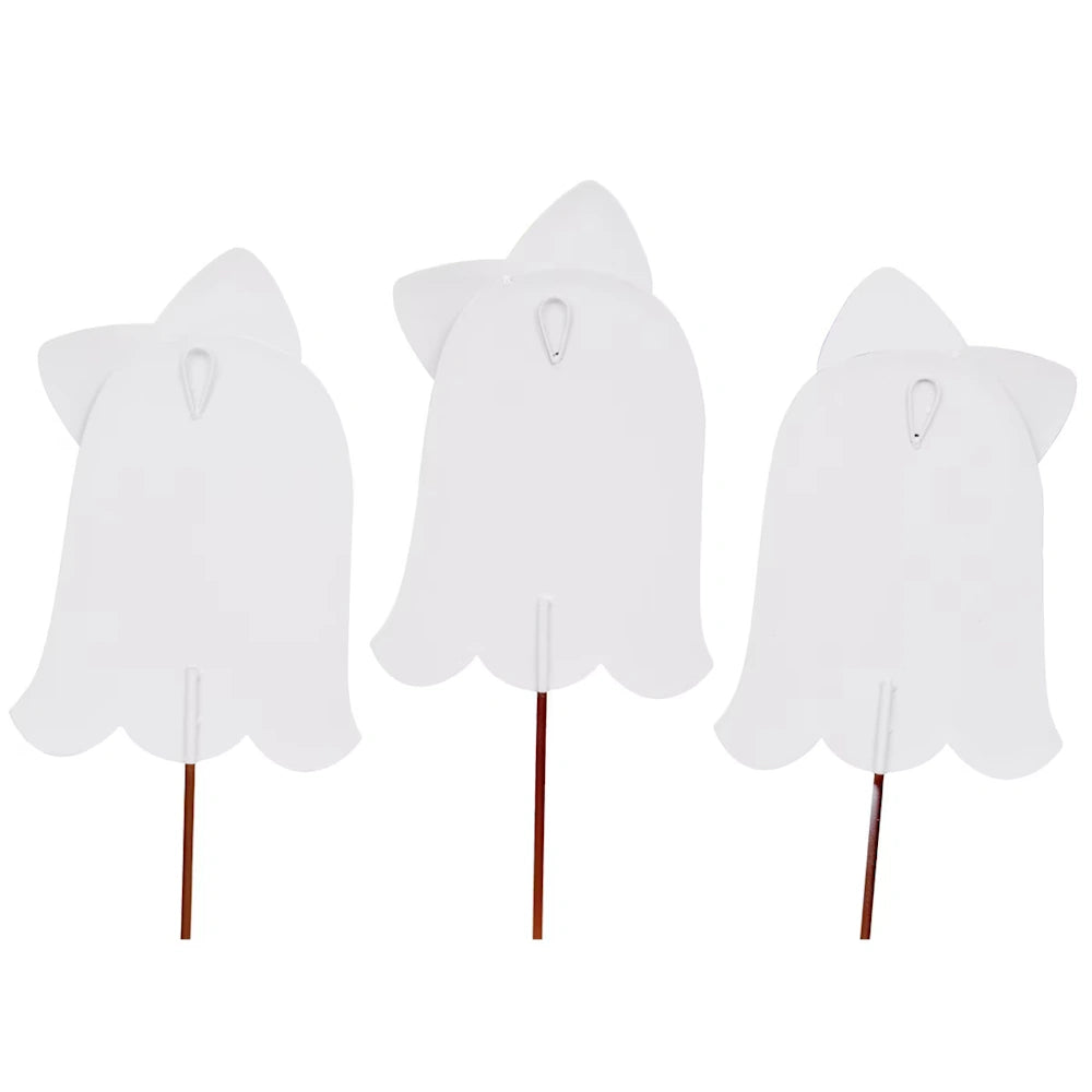 White metal backs of three ghost yard stakes showing the integrated hanging loops and metal ground stakes.