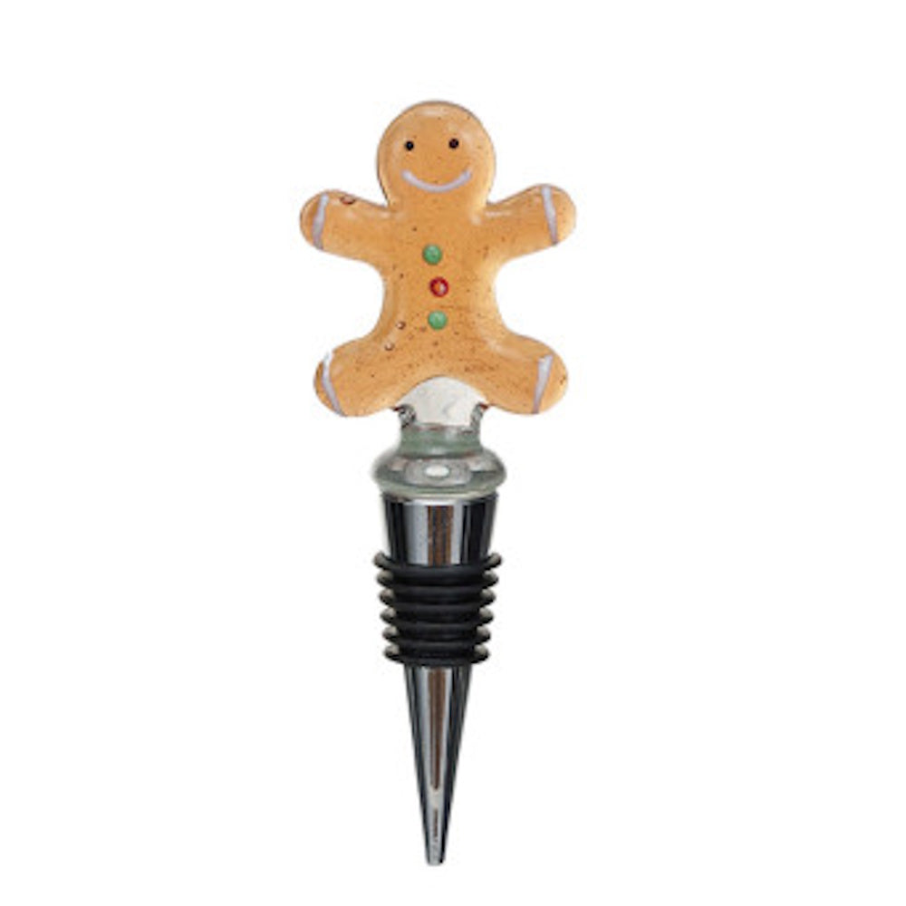 Christmas gingerbread man bottle stopper with a smiling face and a ribbed metal base.