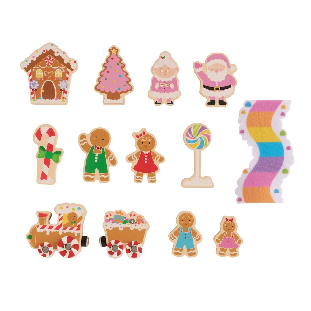 Wooden gingerbread-themed play set featuring figures, a toy train, candies, and a colorful pathway.