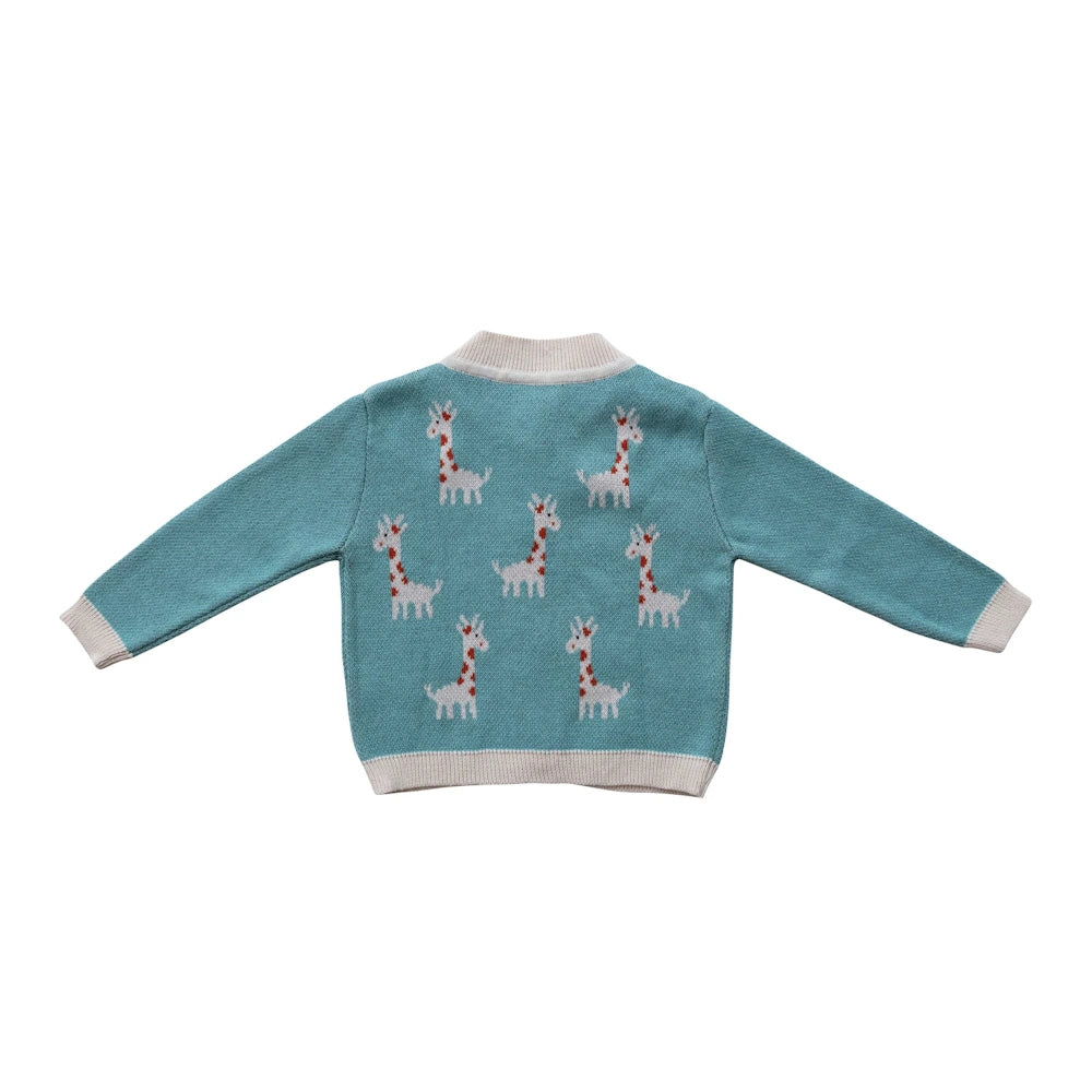 Blue knit baby cardigan with white and red giraffe patterns and ribbed trim.
