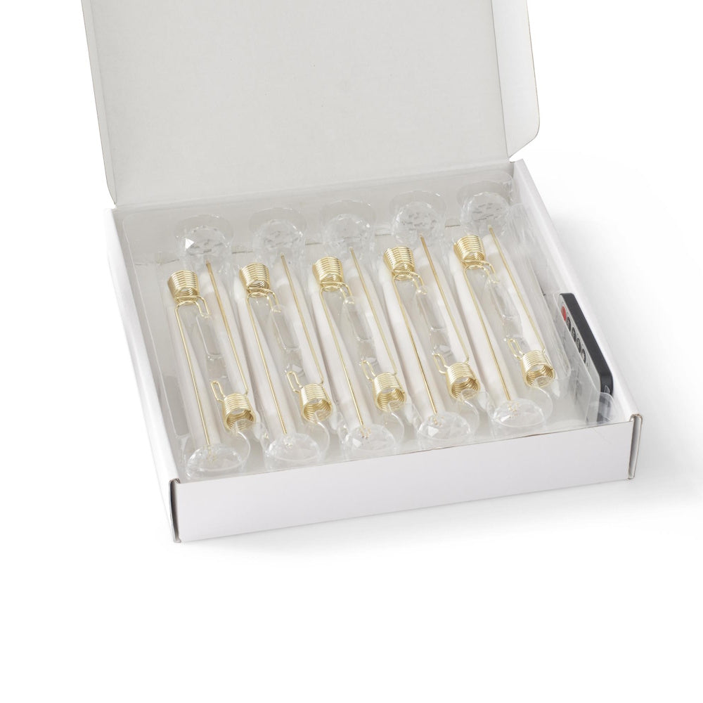 Set of six LED taper candle ornaments neatly packed in a white presentation box with a remote control.