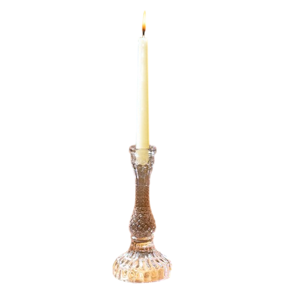 Clear textured glass taper candle holder with a lit white candlestick, vintage diamond-patterned design.