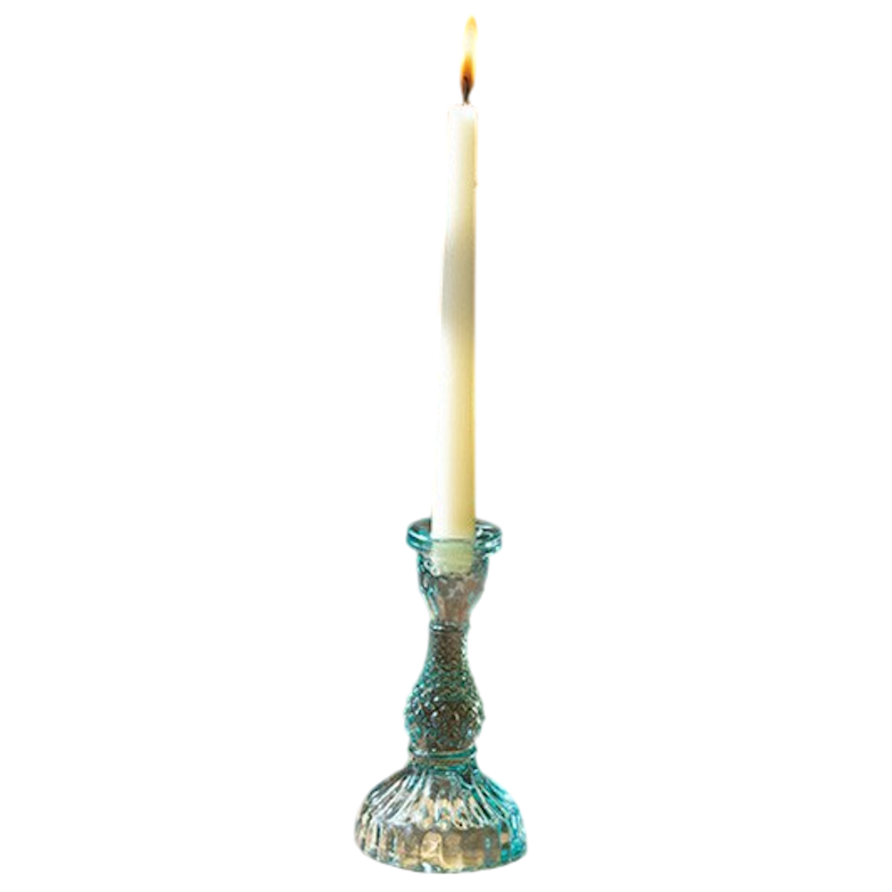 Blue vintage-style textured glass taper candle holder with a lit white candle on a white background.