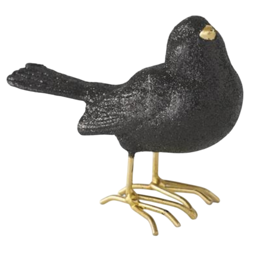 Glittery black resin bird figurine with gold beak and feet.