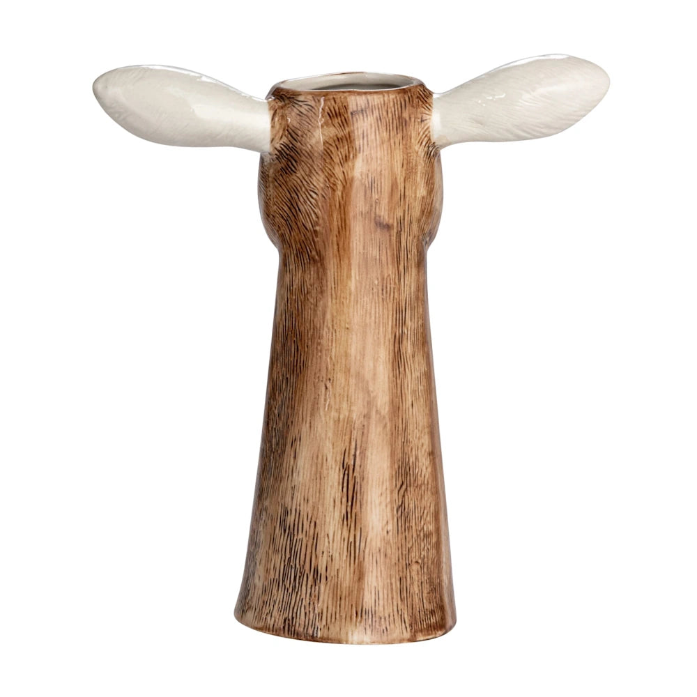 Back view of a hand-painted stoneware goat head vase with a brown textured finish and white ears.