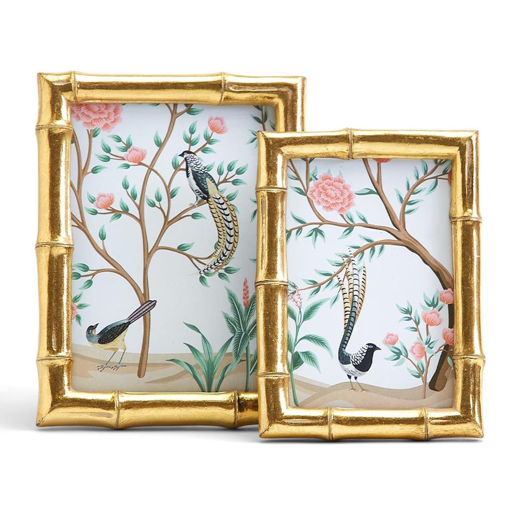 Front view of two gold faux bamboo photo frames featuring botanical bird artwork.