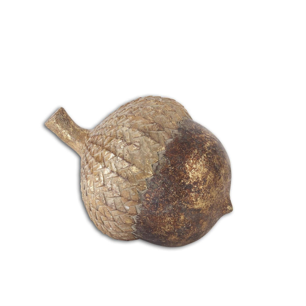 Decorative gold-gilded resin acorn with a textured cap and metallic finish on a plain white background.