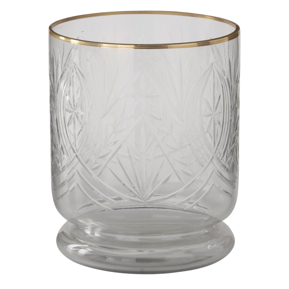 Large cut glass container with intricate star patterns, a gold-gilded rim, and a sturdy rounded base.
