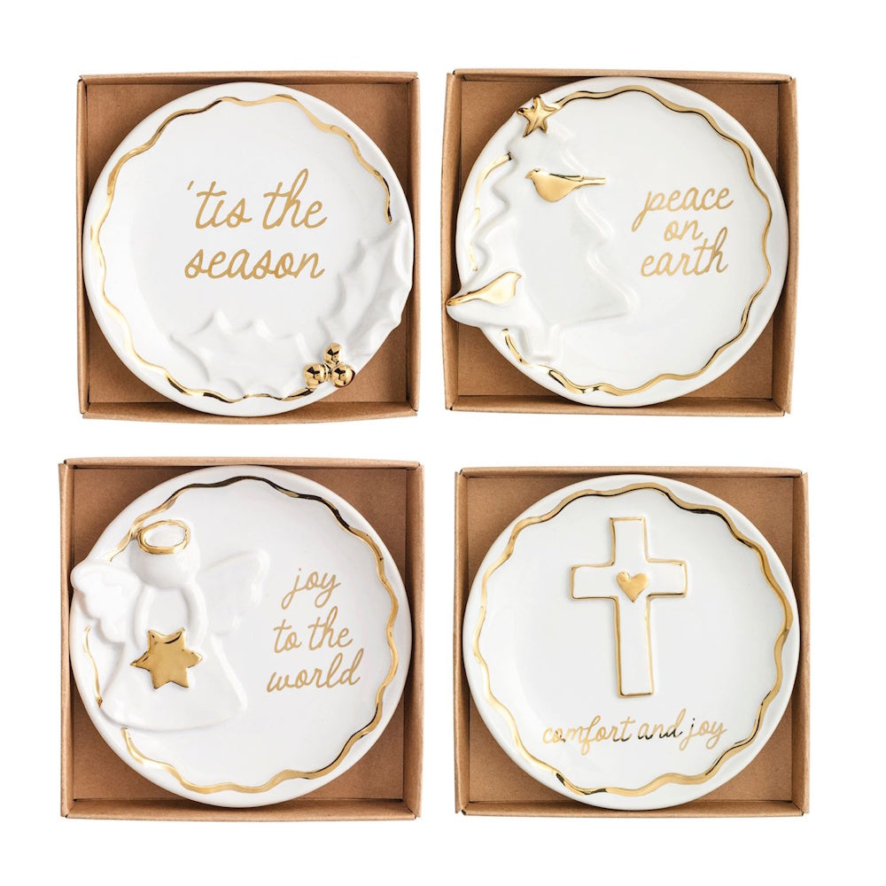 Set of 4 white and gold ceramic holiday trinket dishes with festive icons and inscriptions.