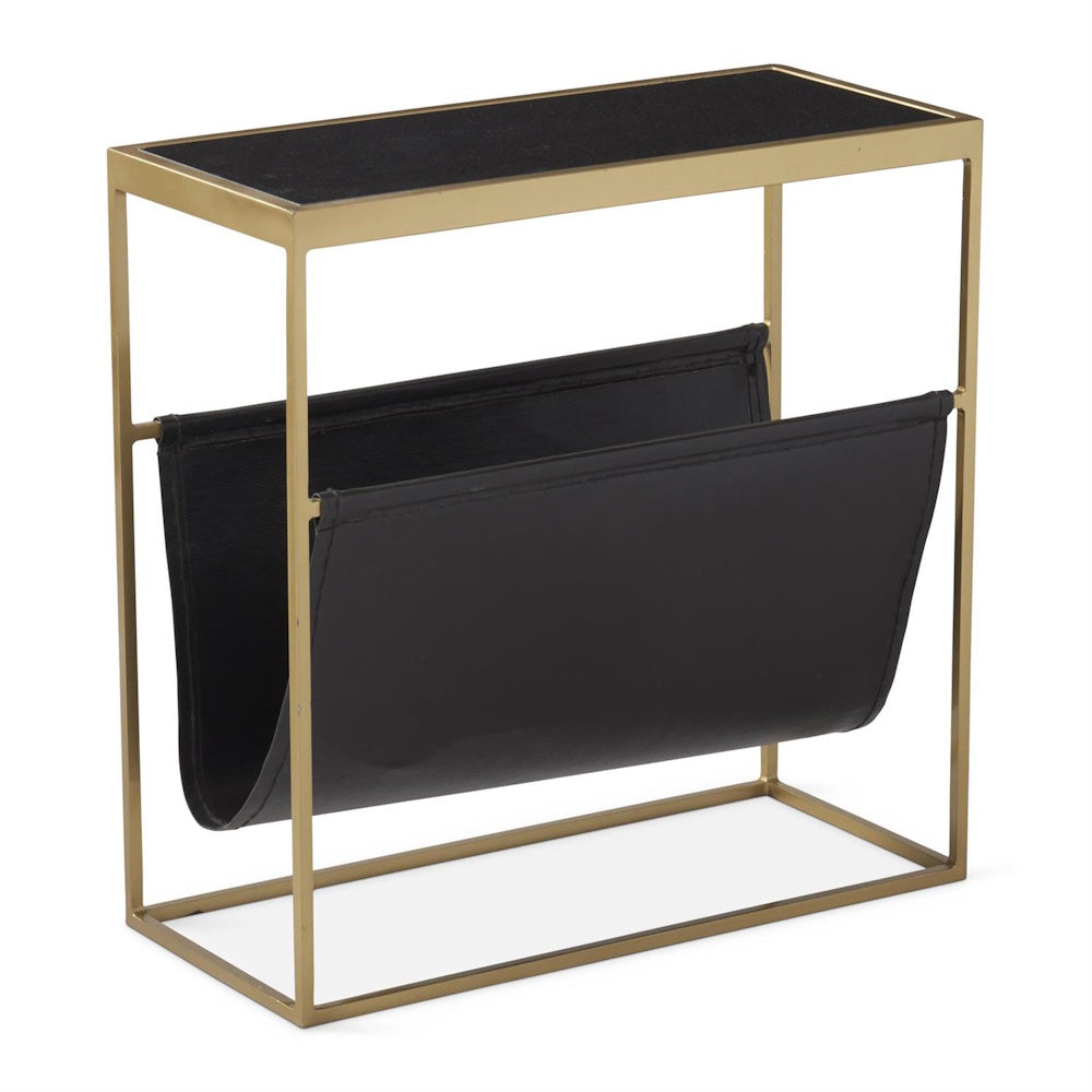 Modern side table with a gold metal frame, black top, and a built-in black magazine holder sling.