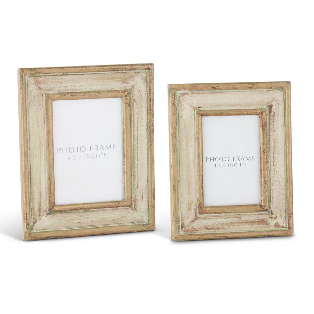 Two handmade carved wood photo frames with a gold and green patina finish in 5x7 and 4x6 sizes on a white background.