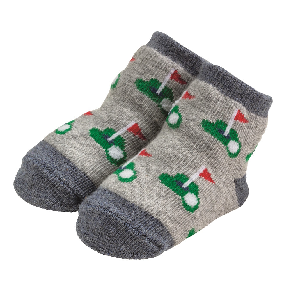 Pair of gray baby socks featuring a green golf course print with red flags and white golf balls on a white background.