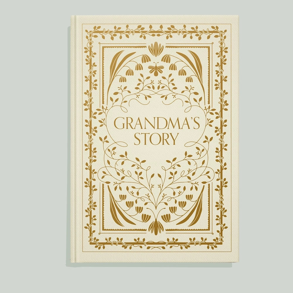 Cream journal cover with gold floral vine patterns and "Grandma's Story" text in an elegant serif font.