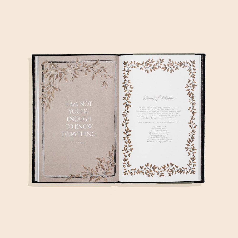 Open keepsake journal showing an Oscar Wilde quote and a "Words of Wisdom" page with elegant leaf borders.