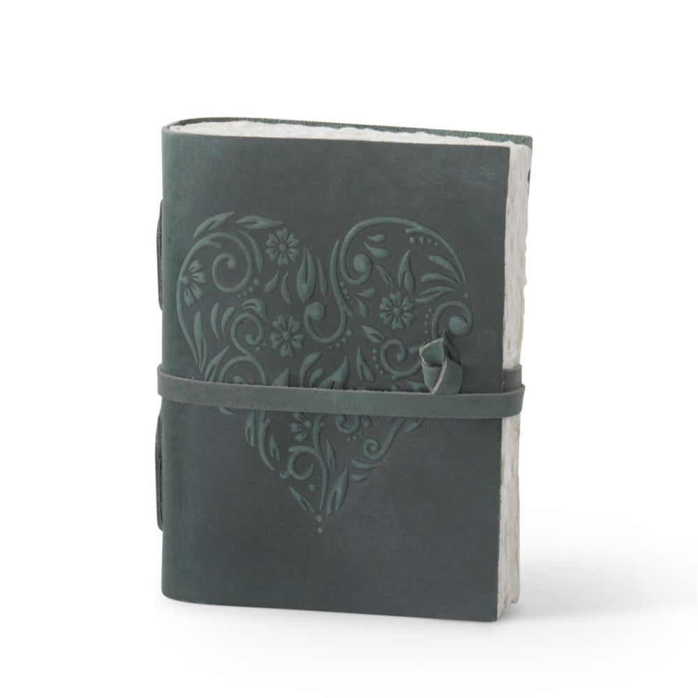 Handcrafted gray leather journal with floral heart embossing, deckle edge paper, and wrap-around strap closure.