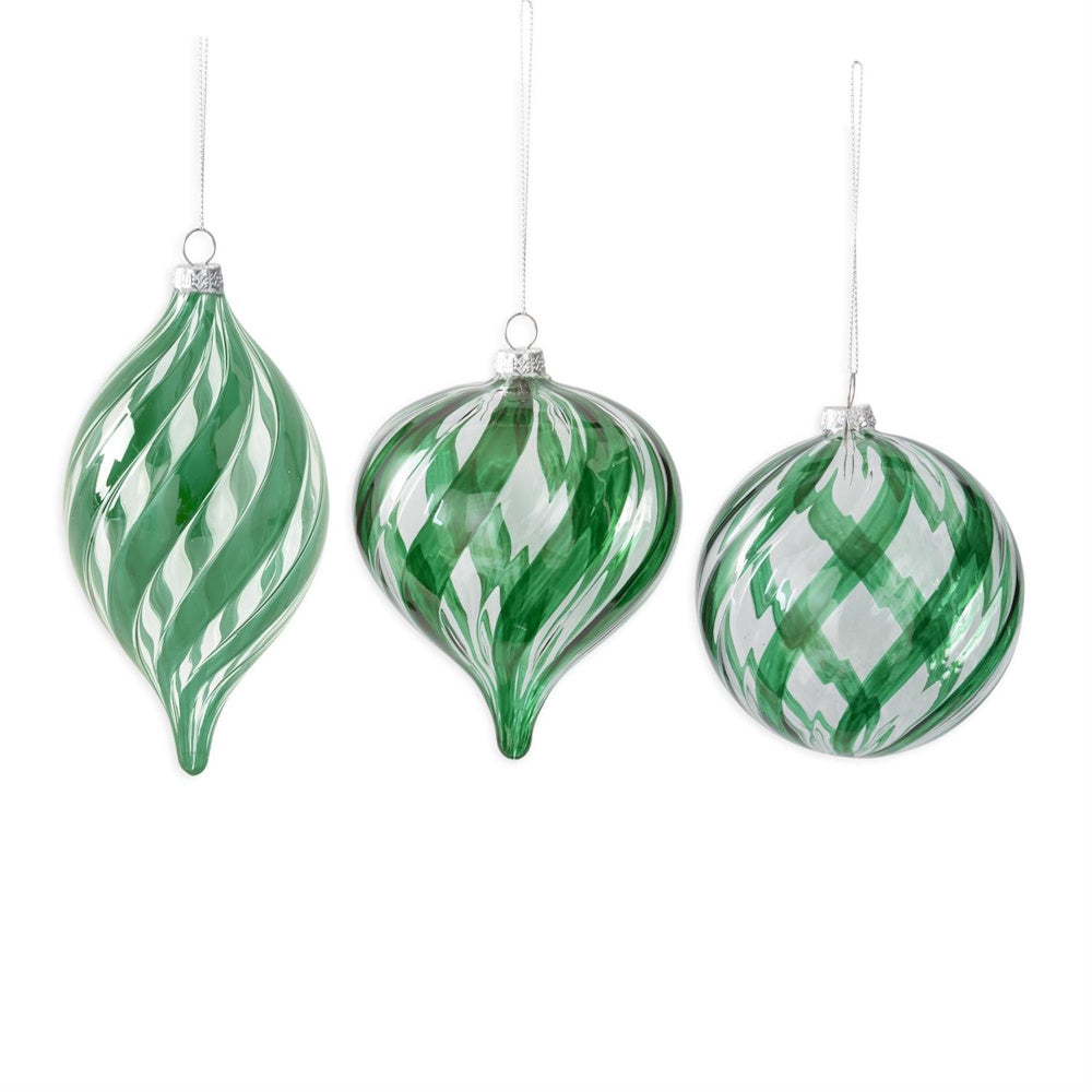 Three green and clear glass hanging ornaments featuring swirled patterns.