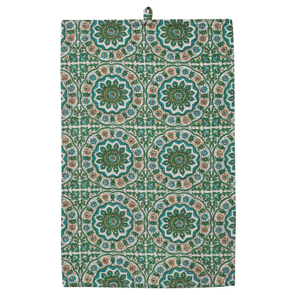 Green cotton slub tea towel featuring a teal and orange floral block print pattern with a convenient hanging loop.