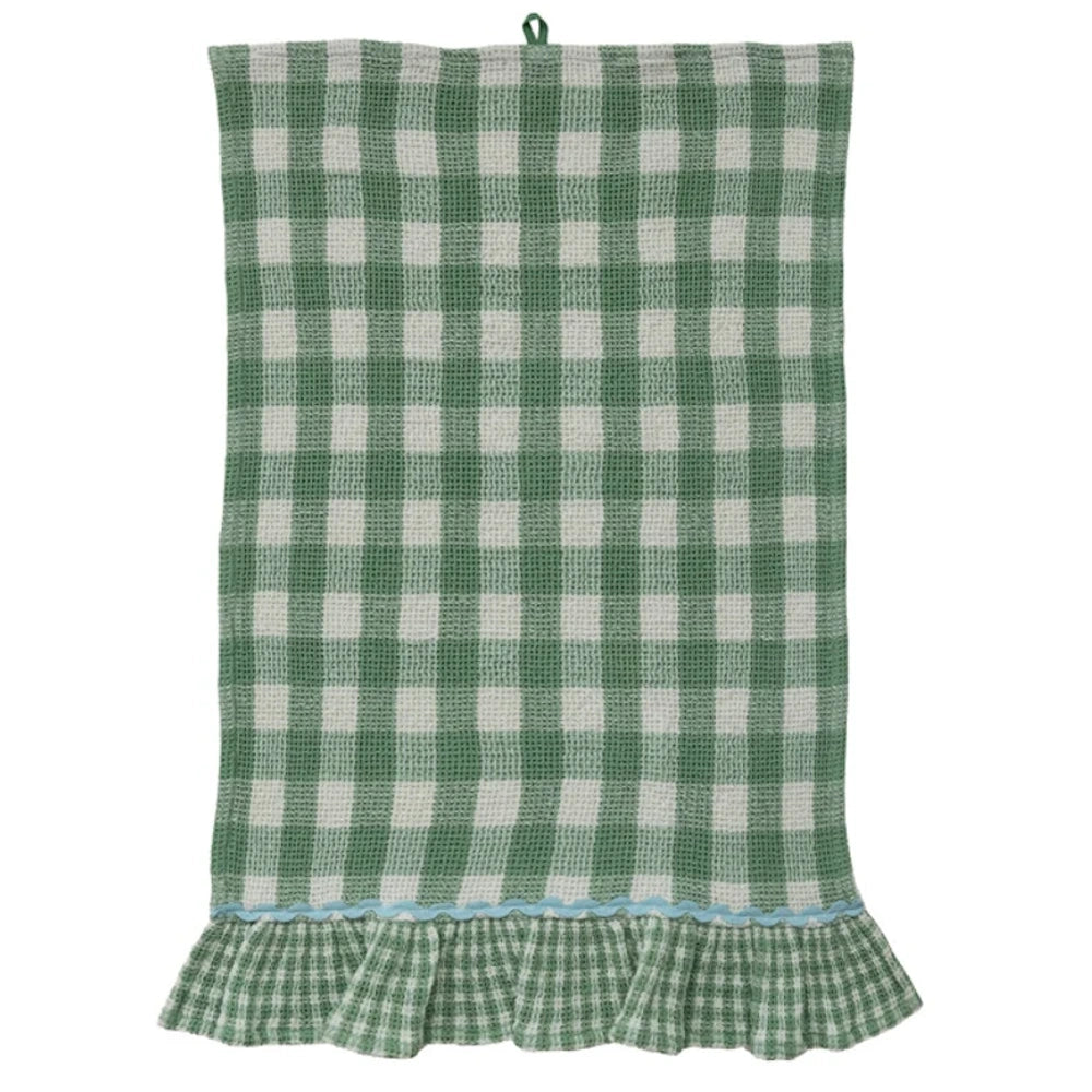 Green and white buffalo check waffle-weave kitchen towel with a blue ric-rac trim and ruffled hem.