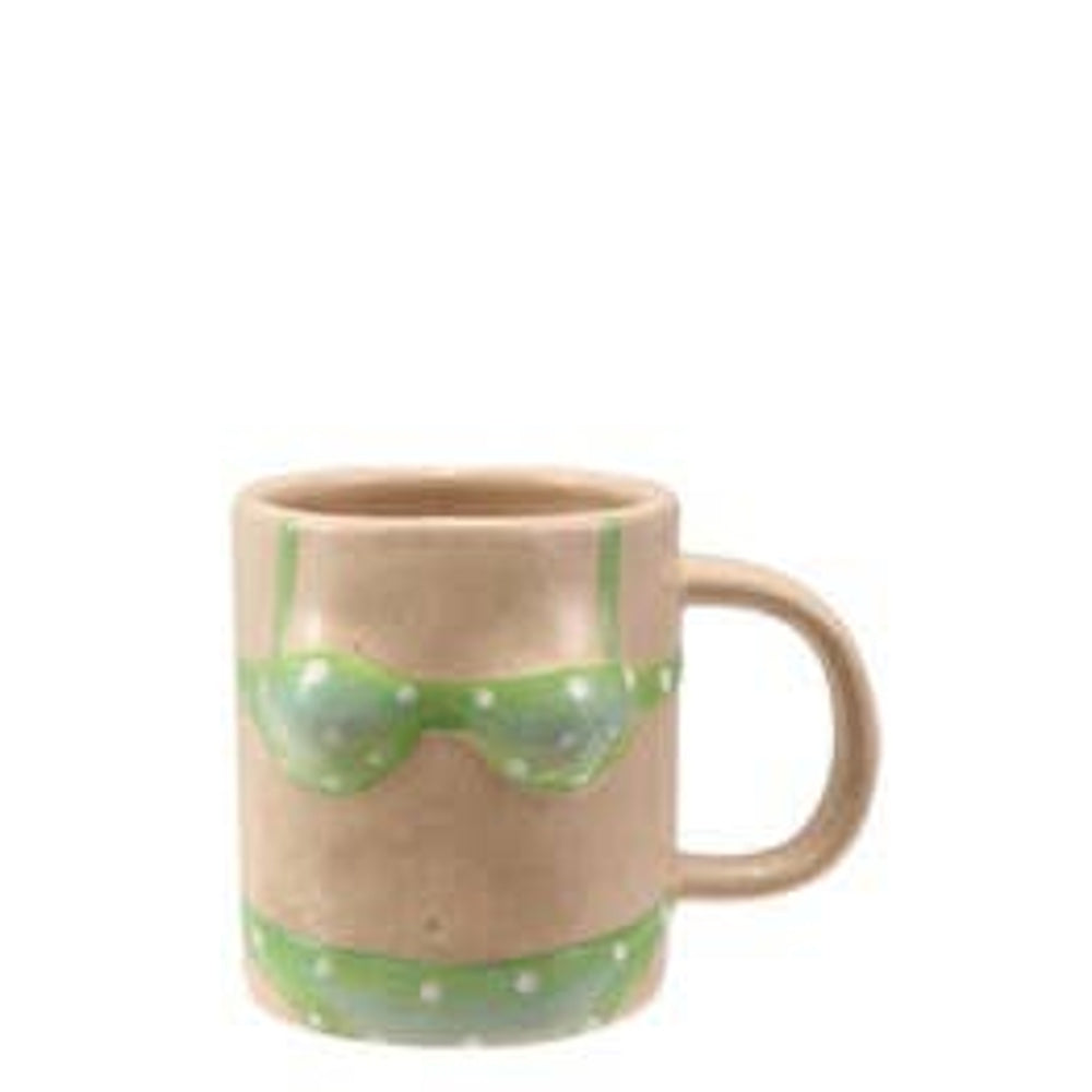 Nude stoneware mug shaped like a body, painted with a light green polka dot bikini.