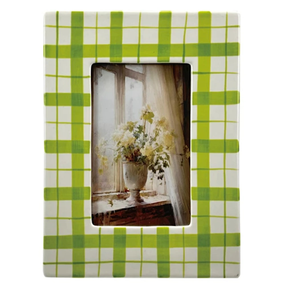 Green gingham check ceramic photo frame with white floral still life art.