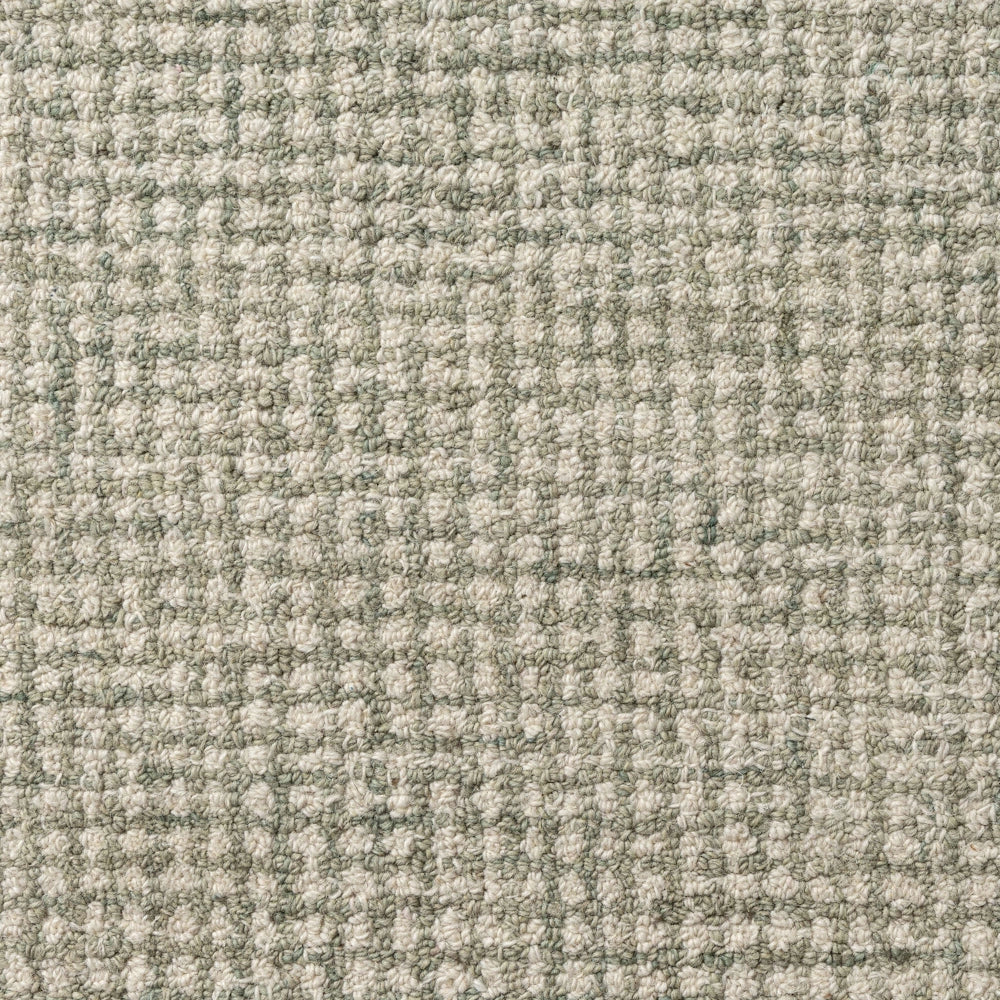 Textured sage green and cream woven carpet with a grid pattern, ideal for modern home interior design.