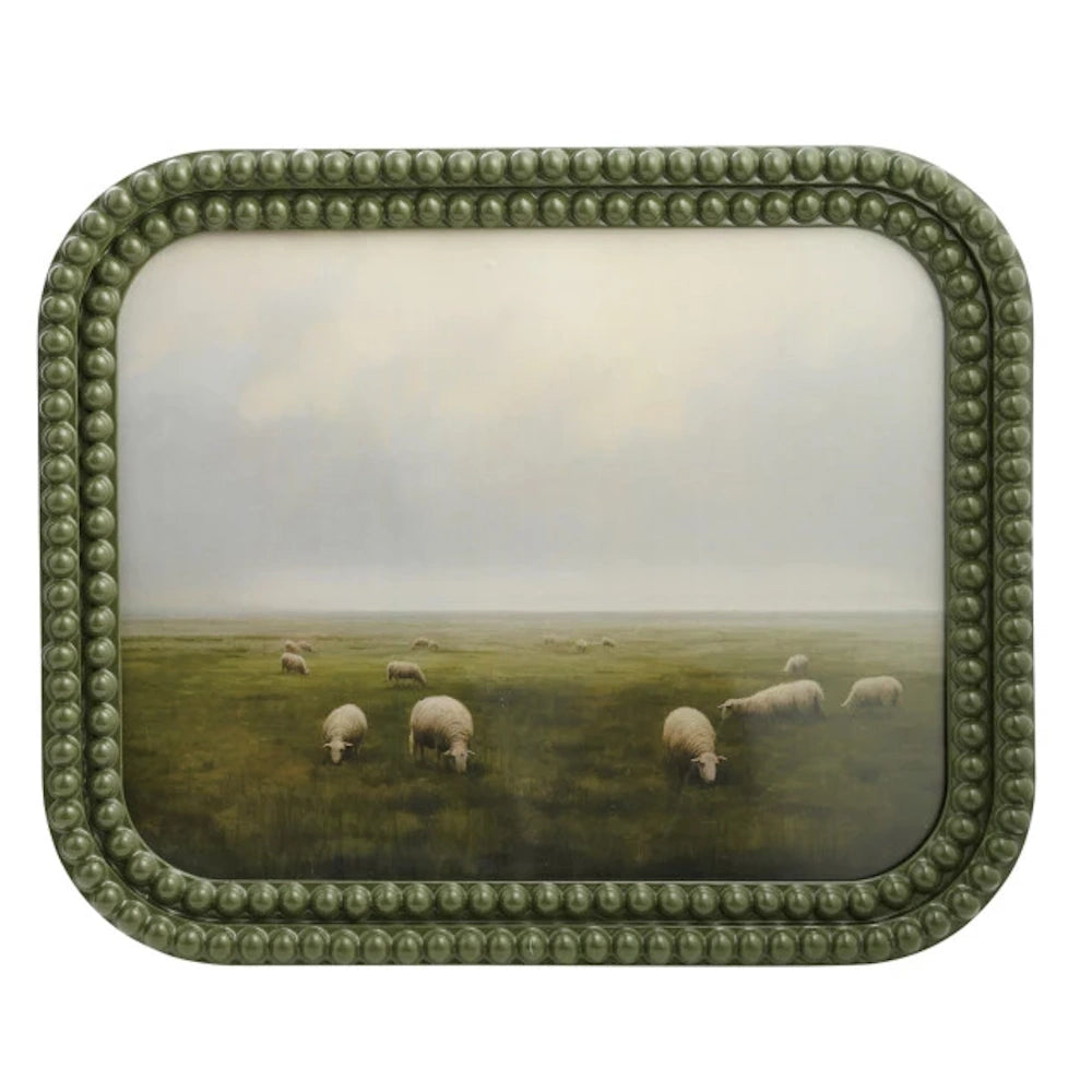 Sheep grazing in a misty green pasture, featured in a decorative olive green bobbin resin picture frame.