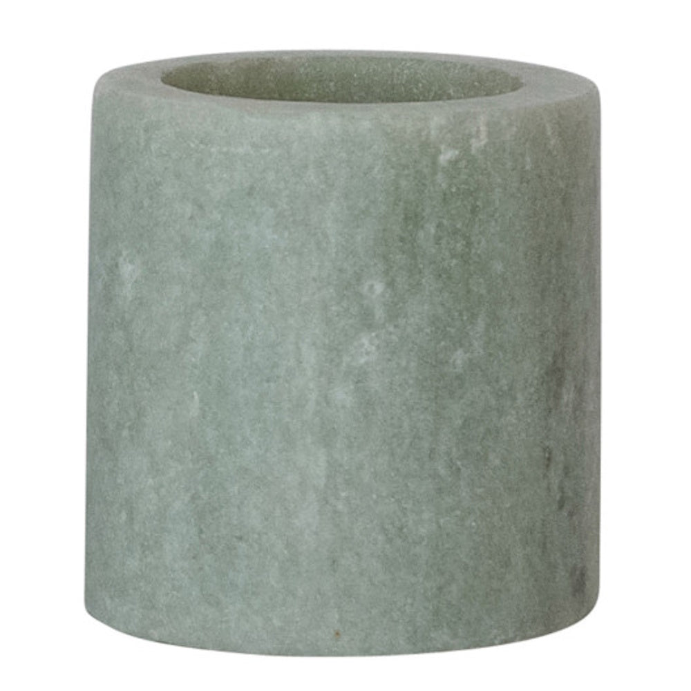 A small cylindrical toothpick holder crafted from textured, light sage green sandstone marble.