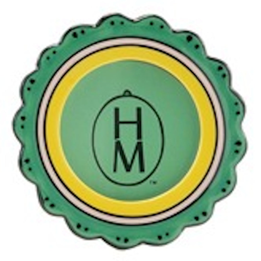 Scalloped green stoneware photo frame magnet with a yellow inner border and a central oval containing the letters HM.