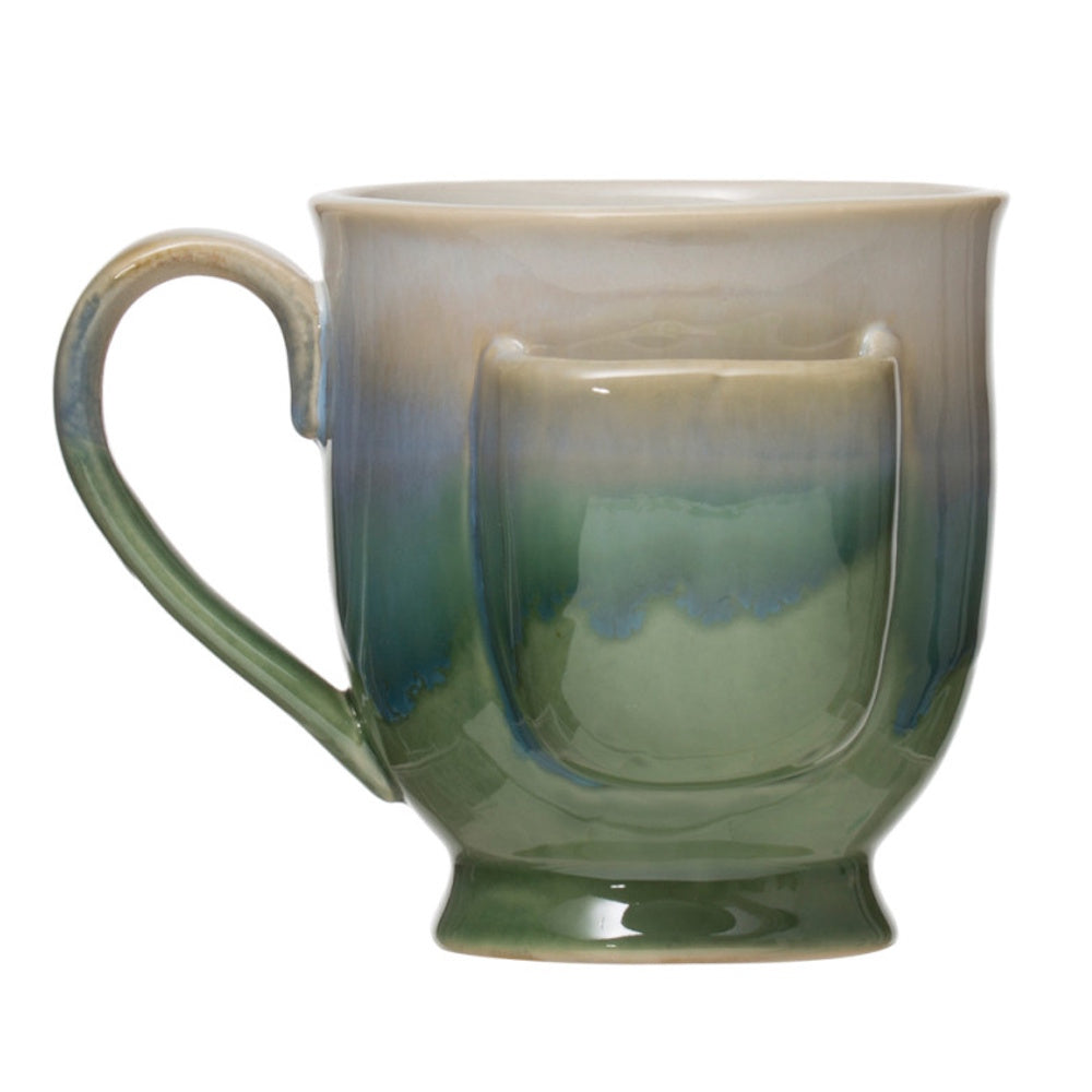 Green stoneware mug with integrated tea bag holder, featuring a blue and cream ombre glazed finish.