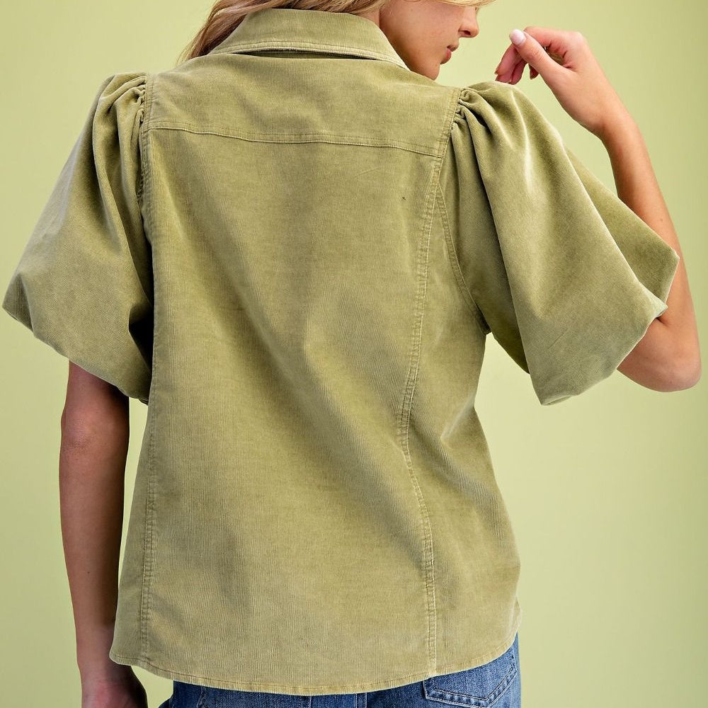 Back view of green-tea washed baby corduroy blouse with gathered puff flutter sleeves.
