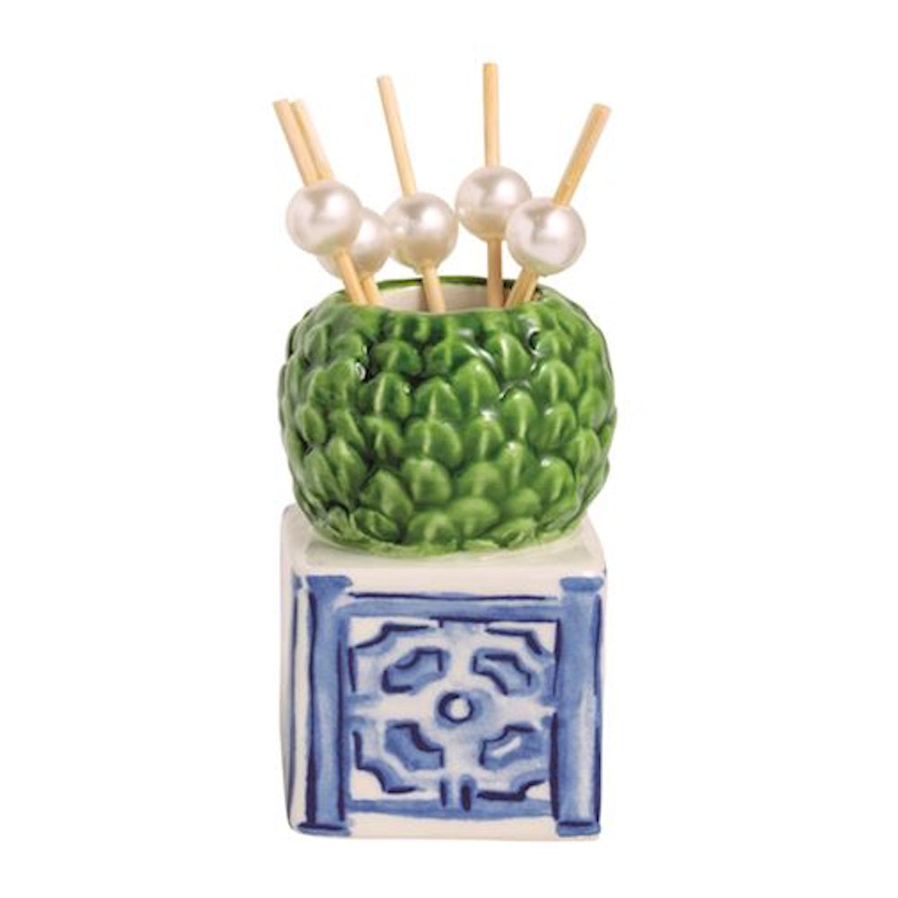 Green boxwood topiary toothpick holder on a blue and white chinoiserie base with pearl picks.