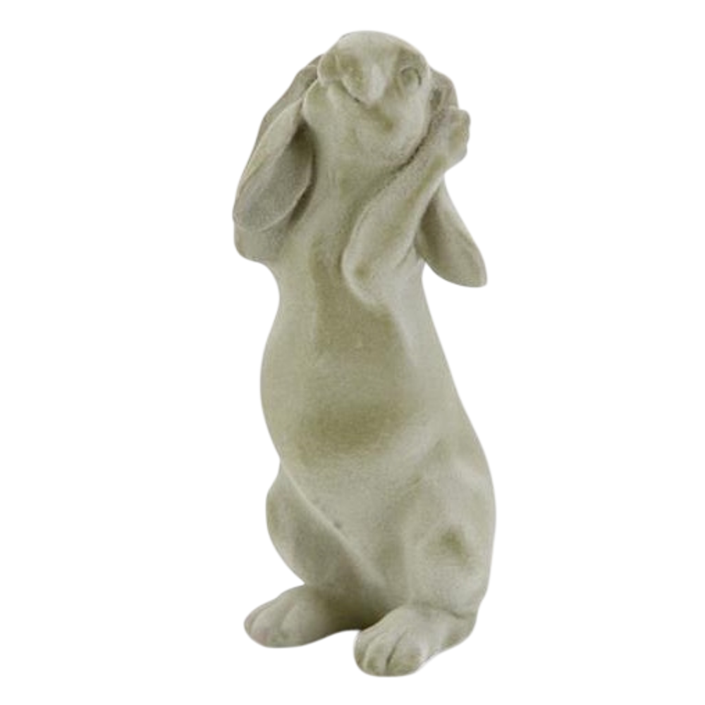 Green velvet resin bunny figurine in a "hear no evil" pose with ears covering its eyes on a white background.