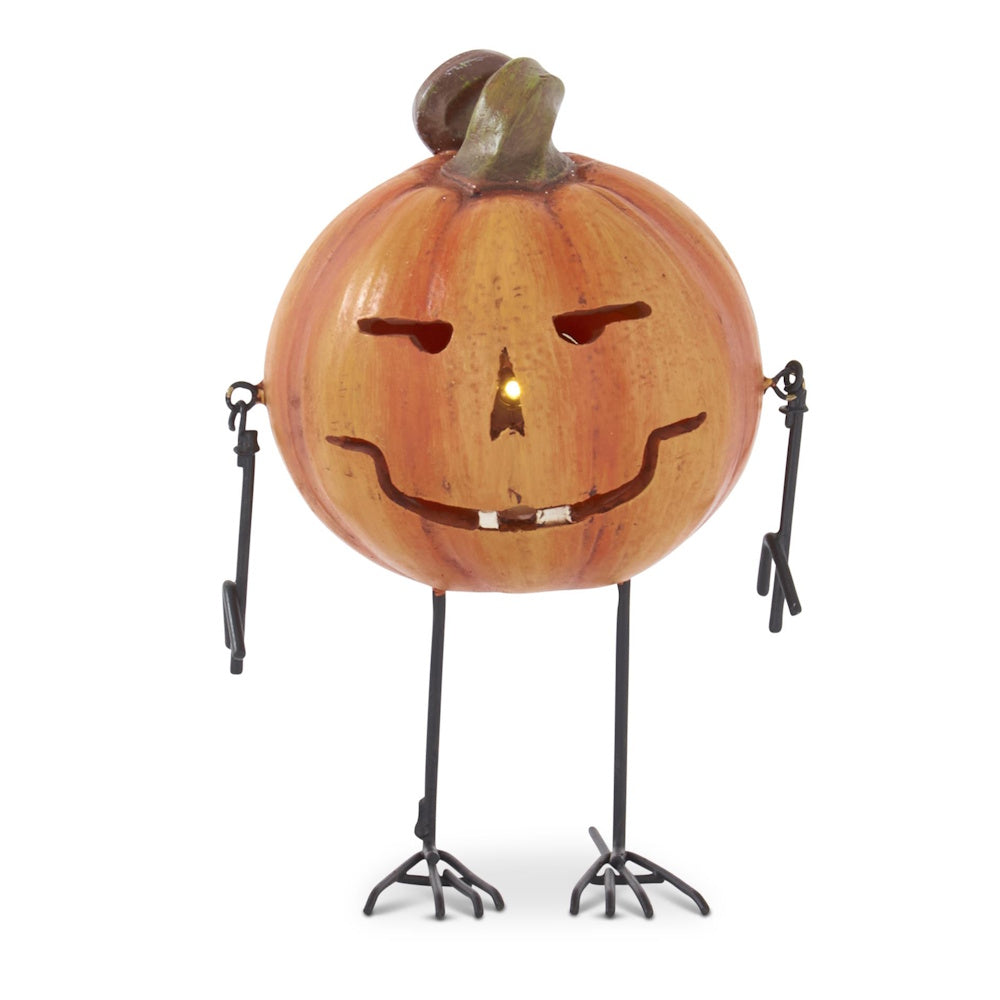 A light-up jack-o'-lantern figurine with thin black metal arms and bird-like legs on a white background.