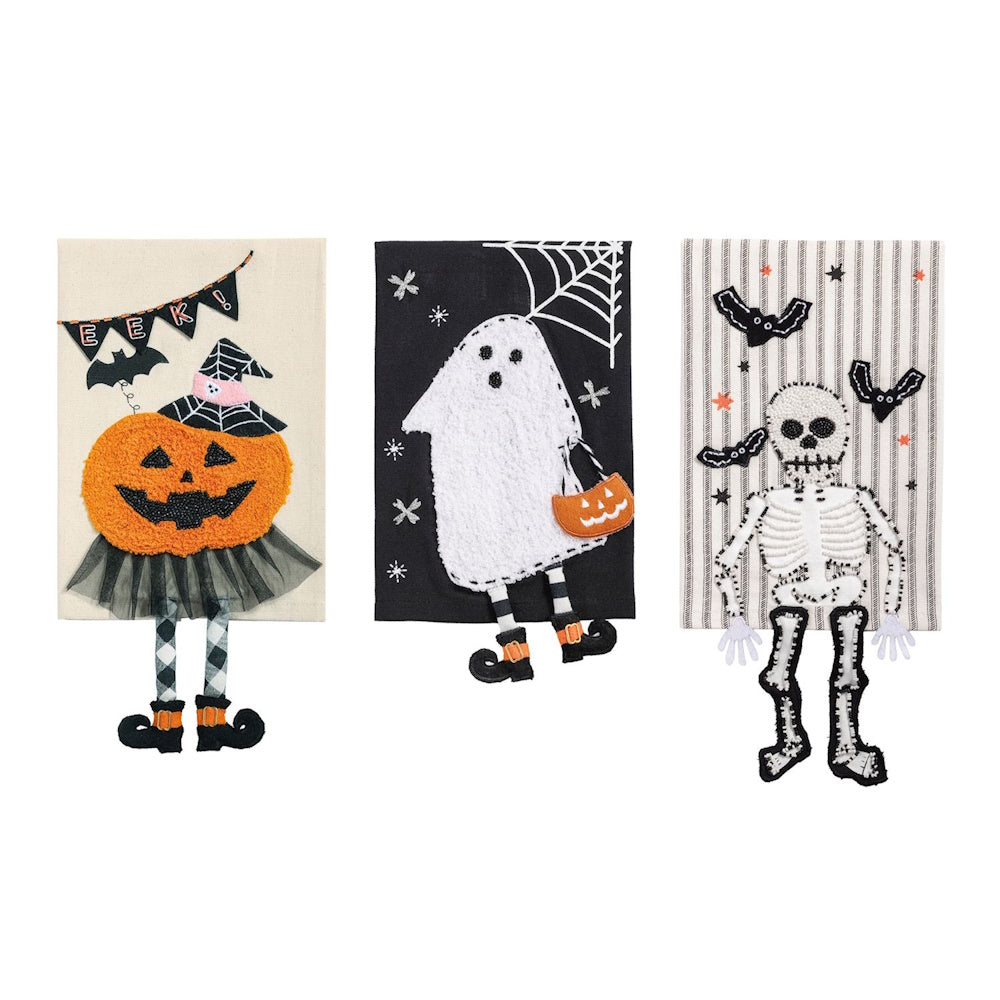 Three Halloween hand towels featuring a pumpkin, a ghost, and a skeleton with dangling legs.