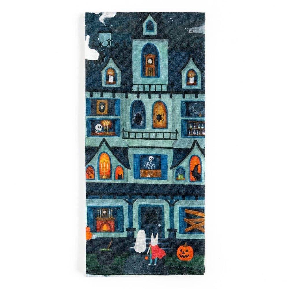Kitchen towel featuring an illustration of a spooky haunted house filled with Halloween figures and trick-or-treaters.