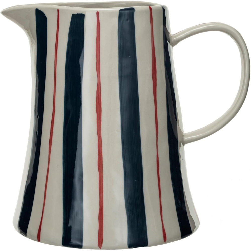 Hand-painted ceramic pitcher featuring vertical navy blue and thin red stripes on an off-white background.
