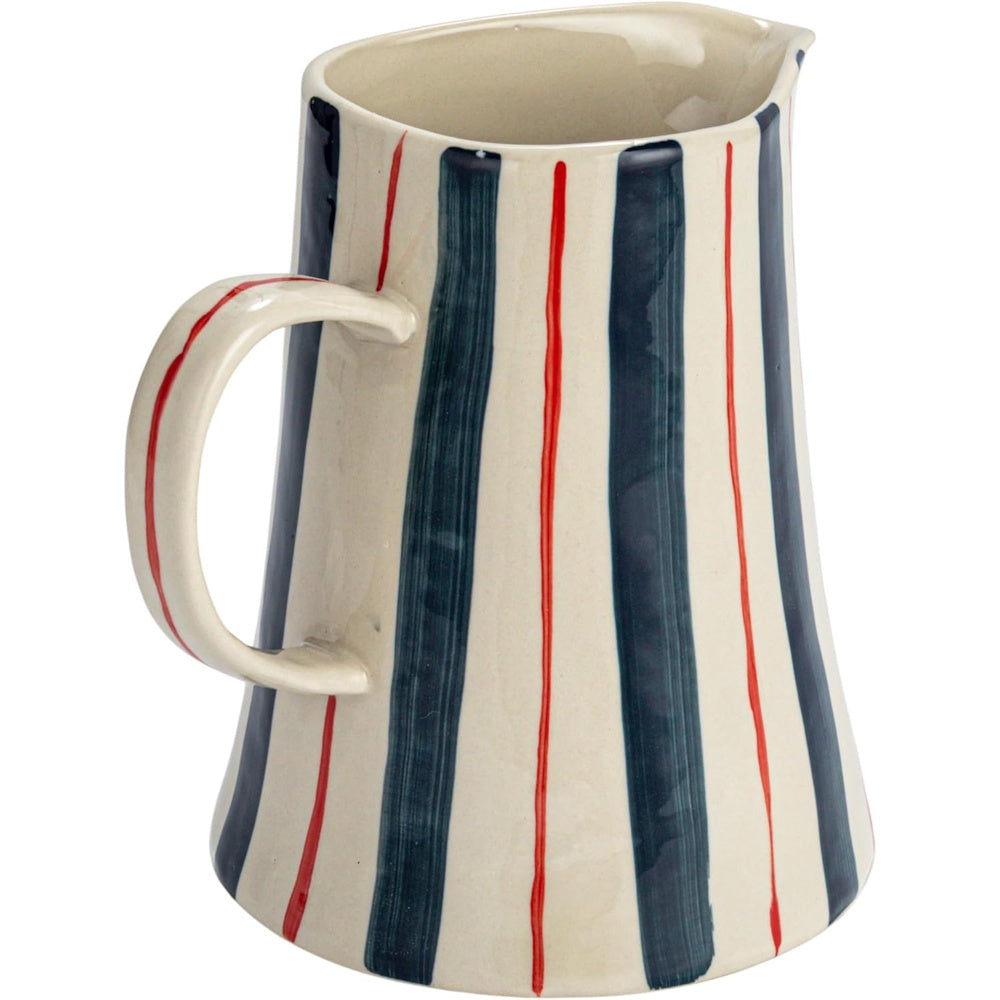 Ceramic pitcher with hand-painted thick navy blue and thin red vertical stripes on an off-white background.