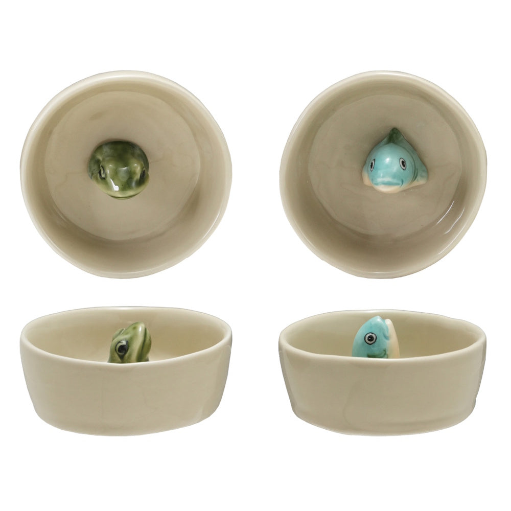 Four views of small stoneware bowls, one featuring a green frog and the other a blue fish peeking out.