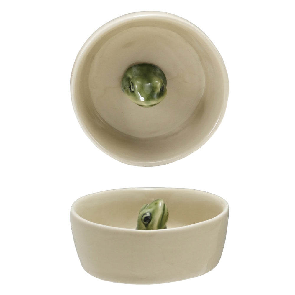 Top-down and side views of a cream ceramic bowl featuring a small green frog figure inside the bottom.