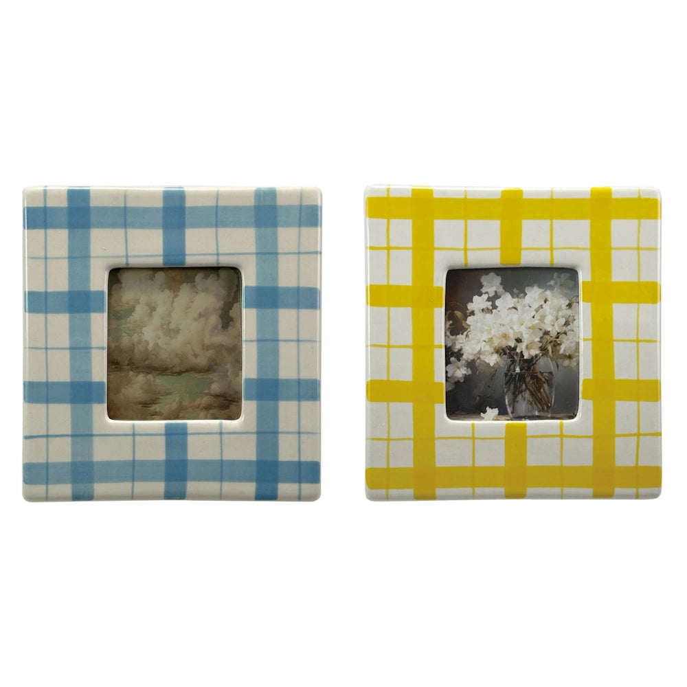 Set of two square ceramic picture frames with blue and yellow plaid patterns featuring clouds and white floral artwork.