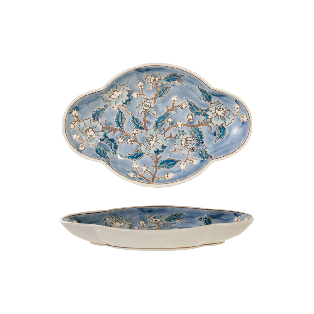 Front and side views of a blue and white hand-painted stoneware plate featuring a floral pattern.