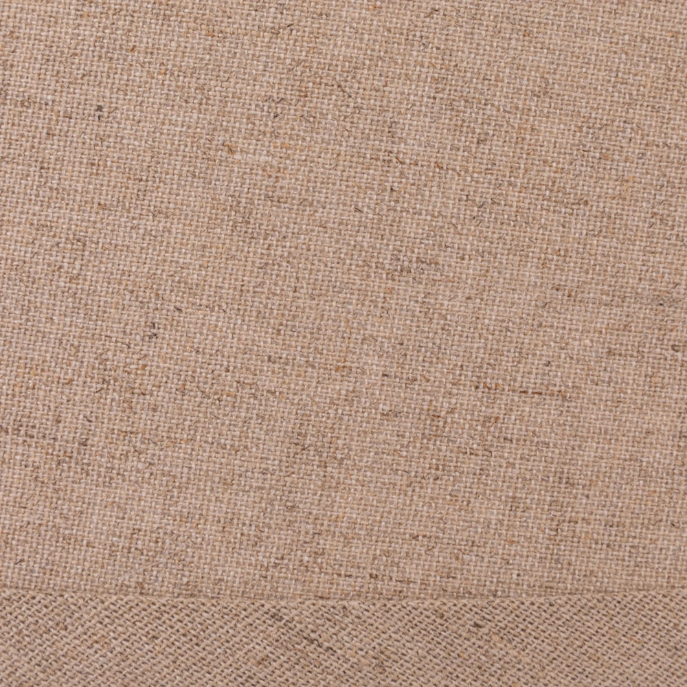Close-up view of the natural beige woven fabric texture on the table lamp shade.