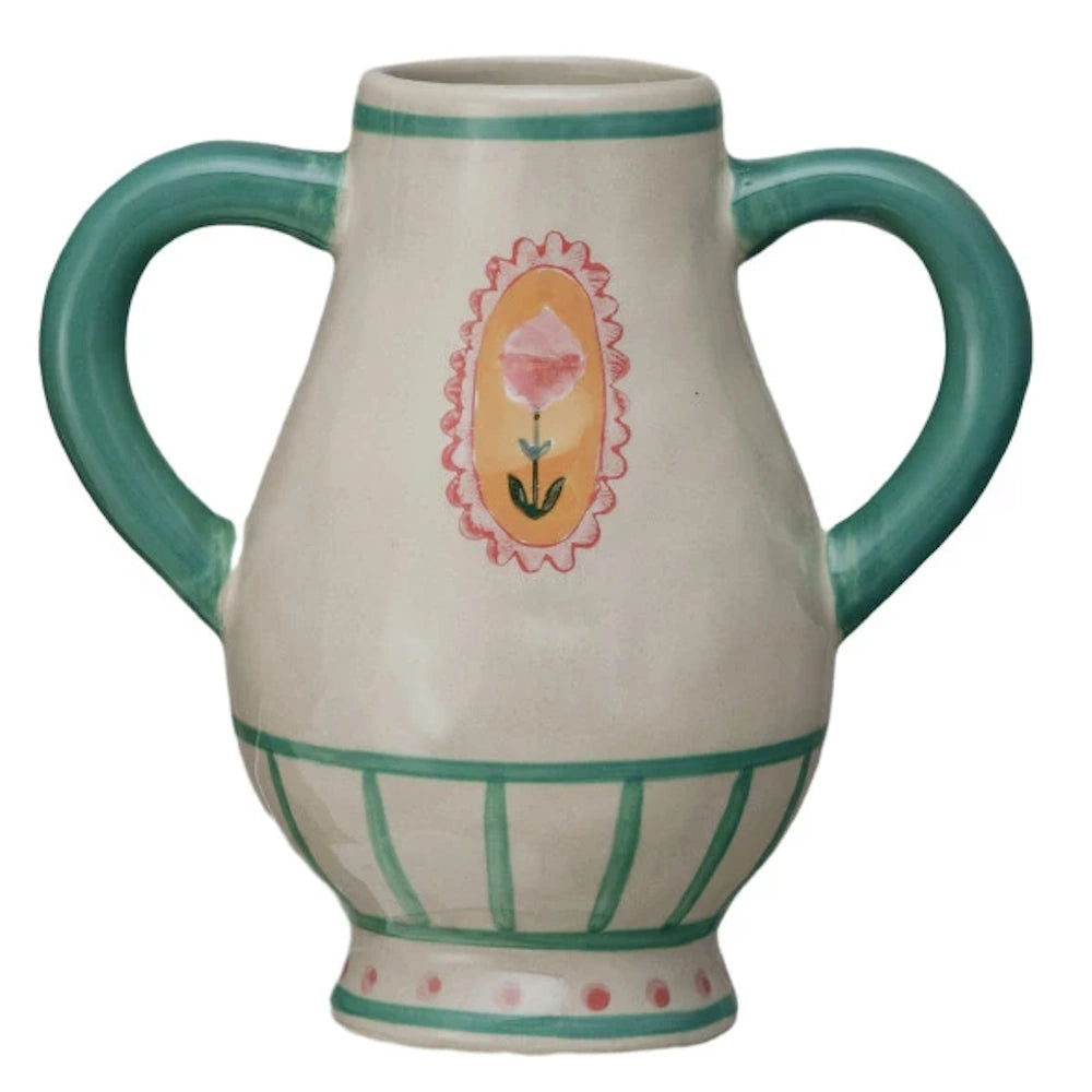 Hand-painted stoneware urn with green handles, a pink floral medallion, and teal striped accents on a white background.