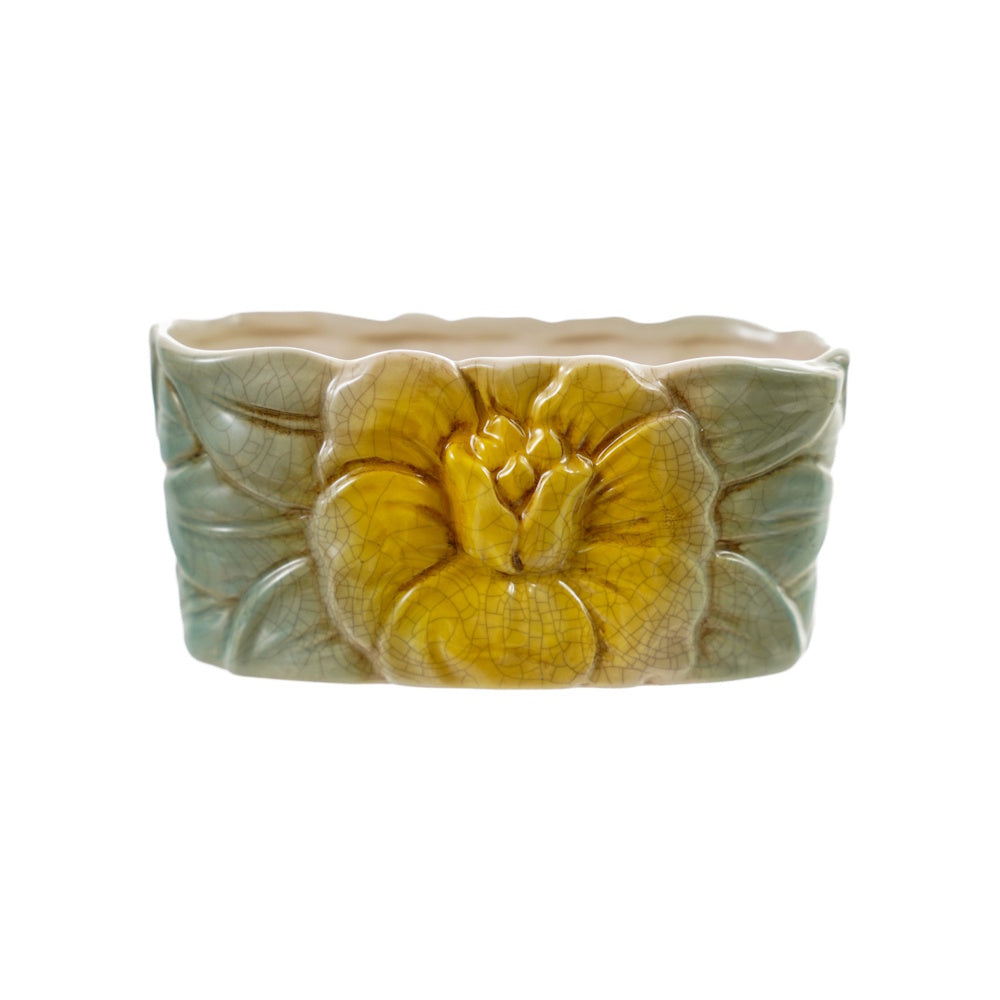 Vintage reproduction hand-painted stoneware container featuring a yellow flower and green leaves.