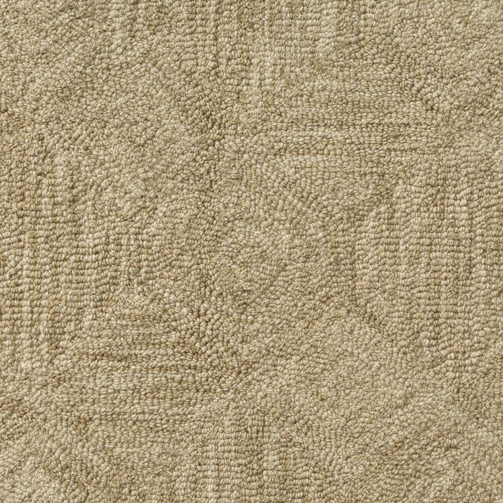 Close up of beige hand tufted rug with textured geometric pattern and tone on tone woven detail.
