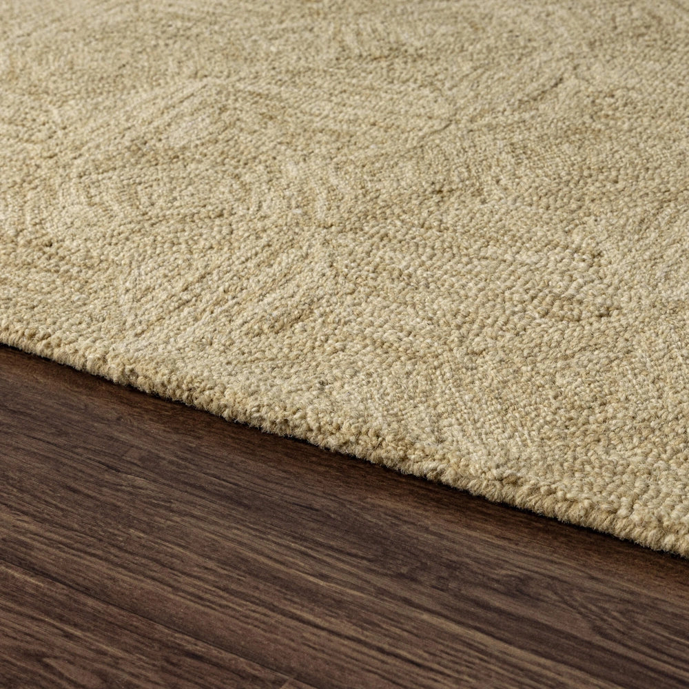 Beige hand tufted area rug with subtle geometric pattern, low profile edge and textured wool like finish.
