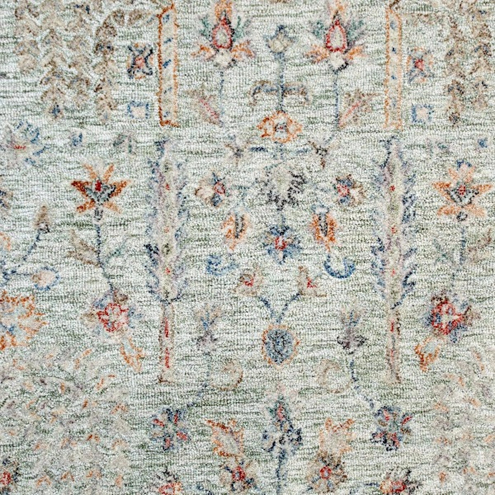 Hand-tufted rectangle vintage rug in sage green with intricate floral patterns.