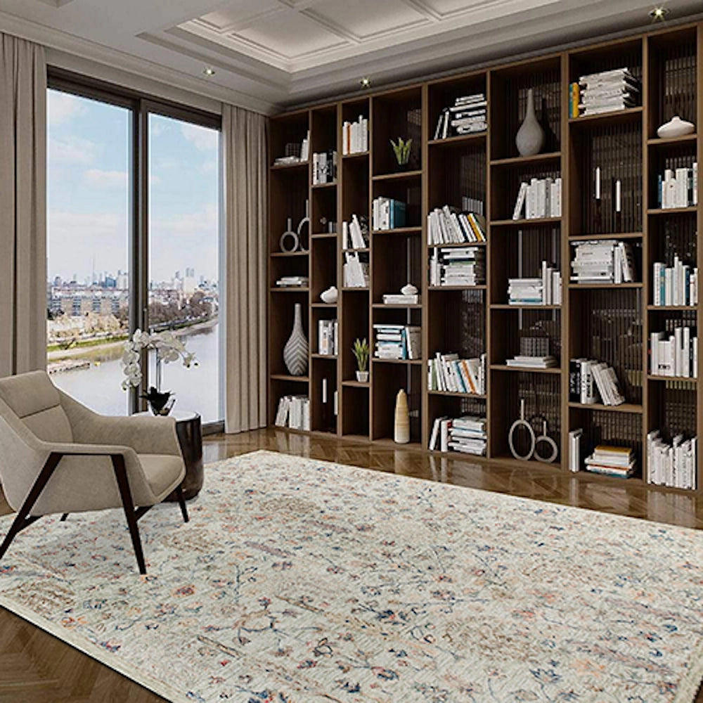 Hand-tufted rectangle vintage sage rug in a modern living room with large bookshelves and city view.